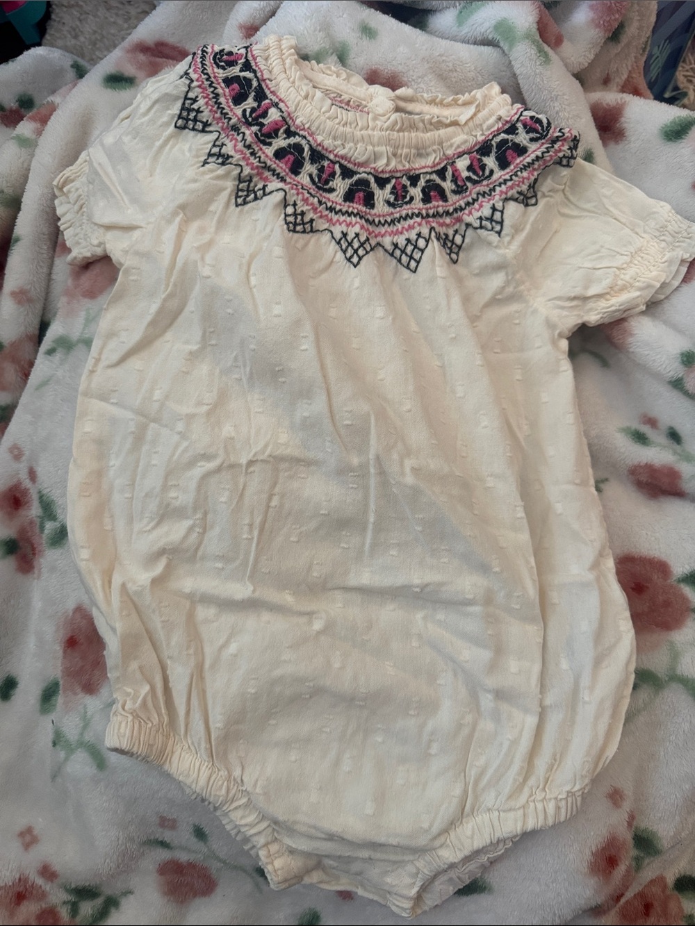 Infants Cream Smocked Neck Short-Sleeve onesie with Pink & Black Embroidery